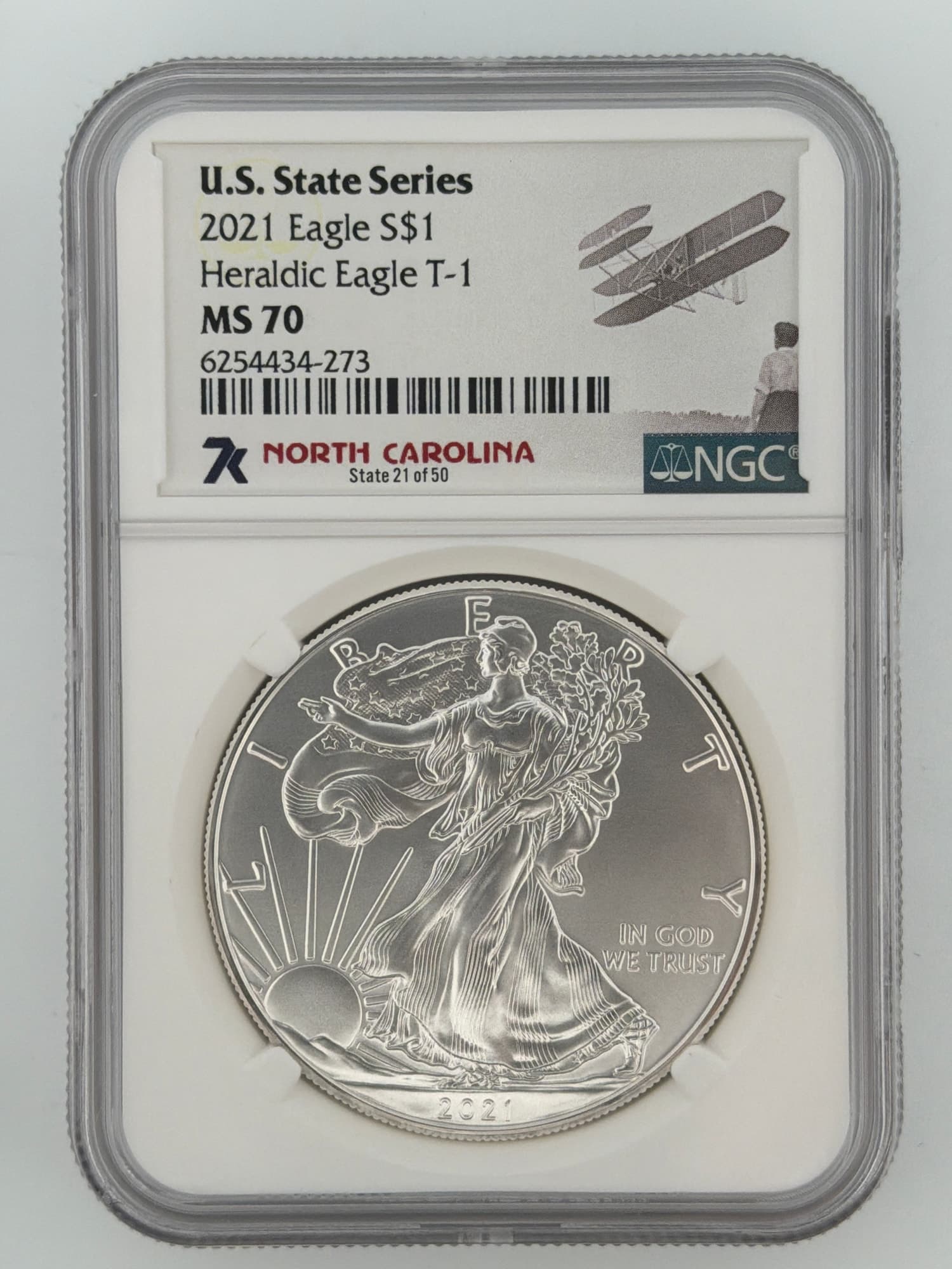 2021 American Silver Eagle MS70 NGC slab obverse with North Carolina U.S. State Series label featuring Wright Brothers Flyer artwork