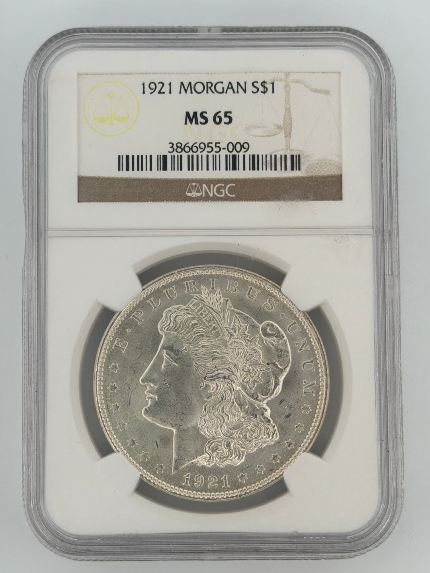 1921 Morgan Silver Dollar NGC MS 65 obverse showing Liberty portrait and E PLURIBUS UNUM in NGC slab cert 3866955-009