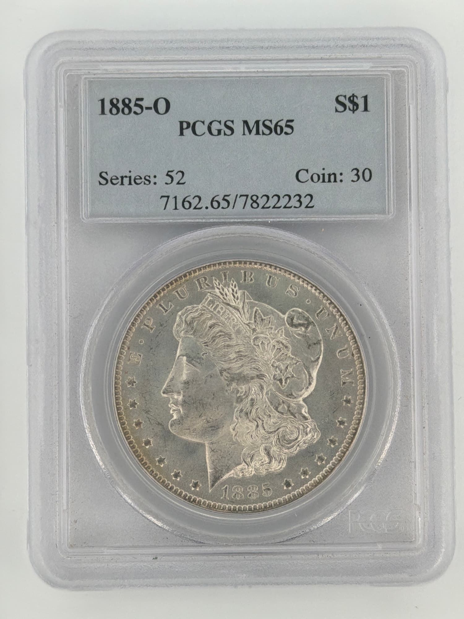 1885-O Morgan Silver Dollar PCGS MS65 obverse showing Liberty portrait and E Pluribus Unum legend in PCGS slab