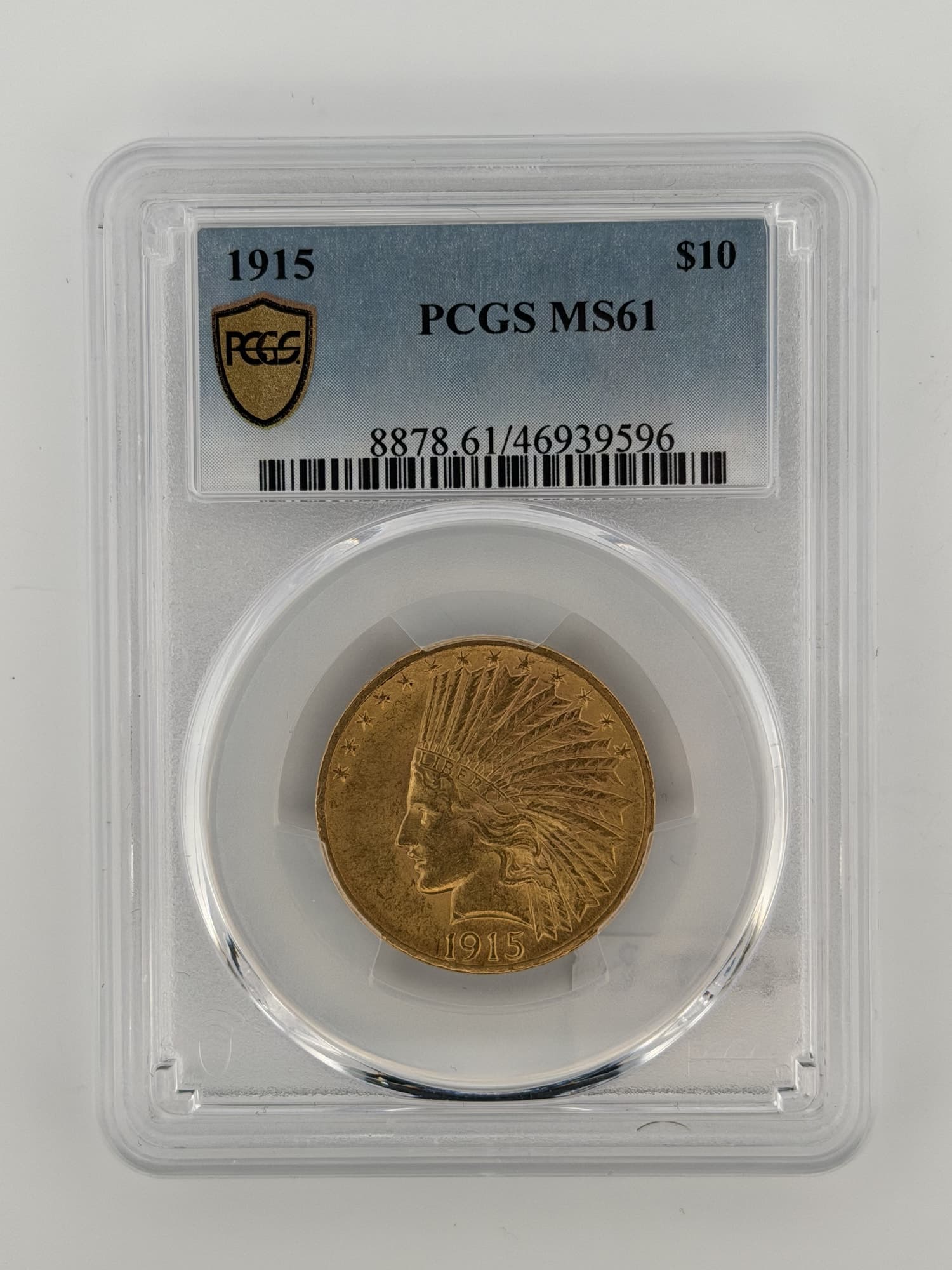 1915-P $10 Indian Head Gold Eagle PCGS MS61 obverse showing feathered war bonnet portrait in PCGS slab cert 46939596