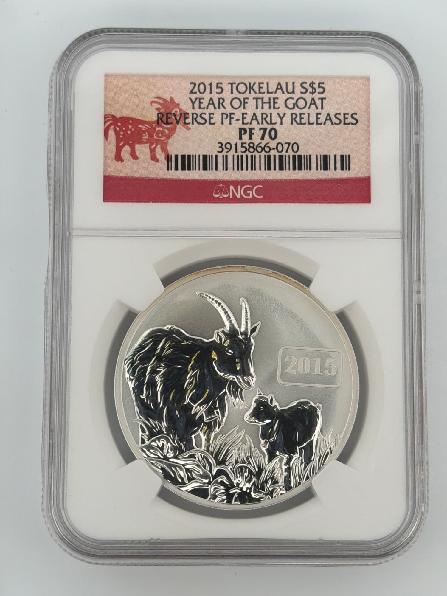 2015 Tokelau Year of the Goat 1 oz Silver $5 NGC PF70 Reverse Proof Early Releases slab, reverse side showing mother goat and kid design