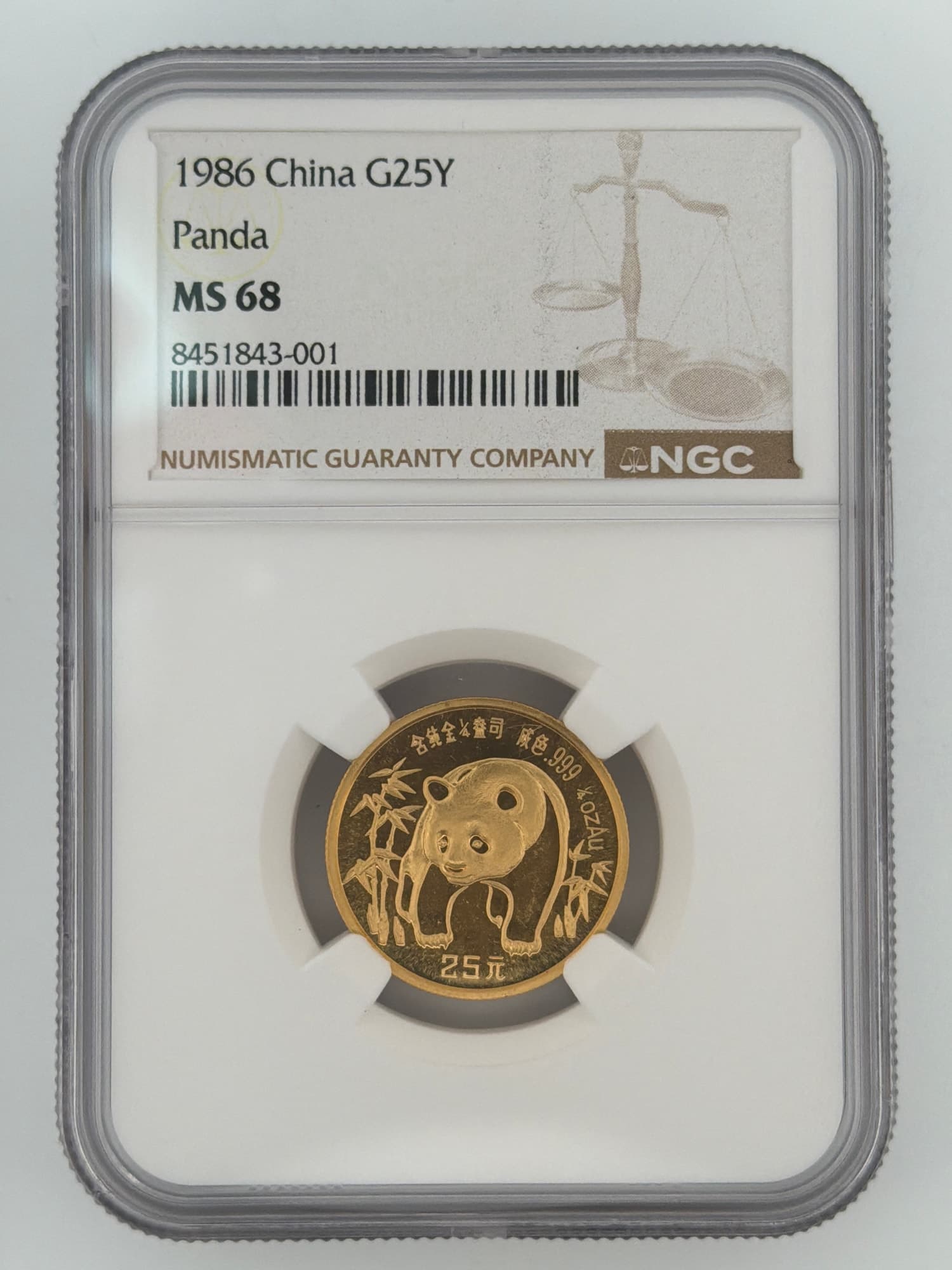 1986 China Gold Panda 25 Yuan NGC MS 68 obverse showing panda among bamboo in NGC slab cert 8451843-001