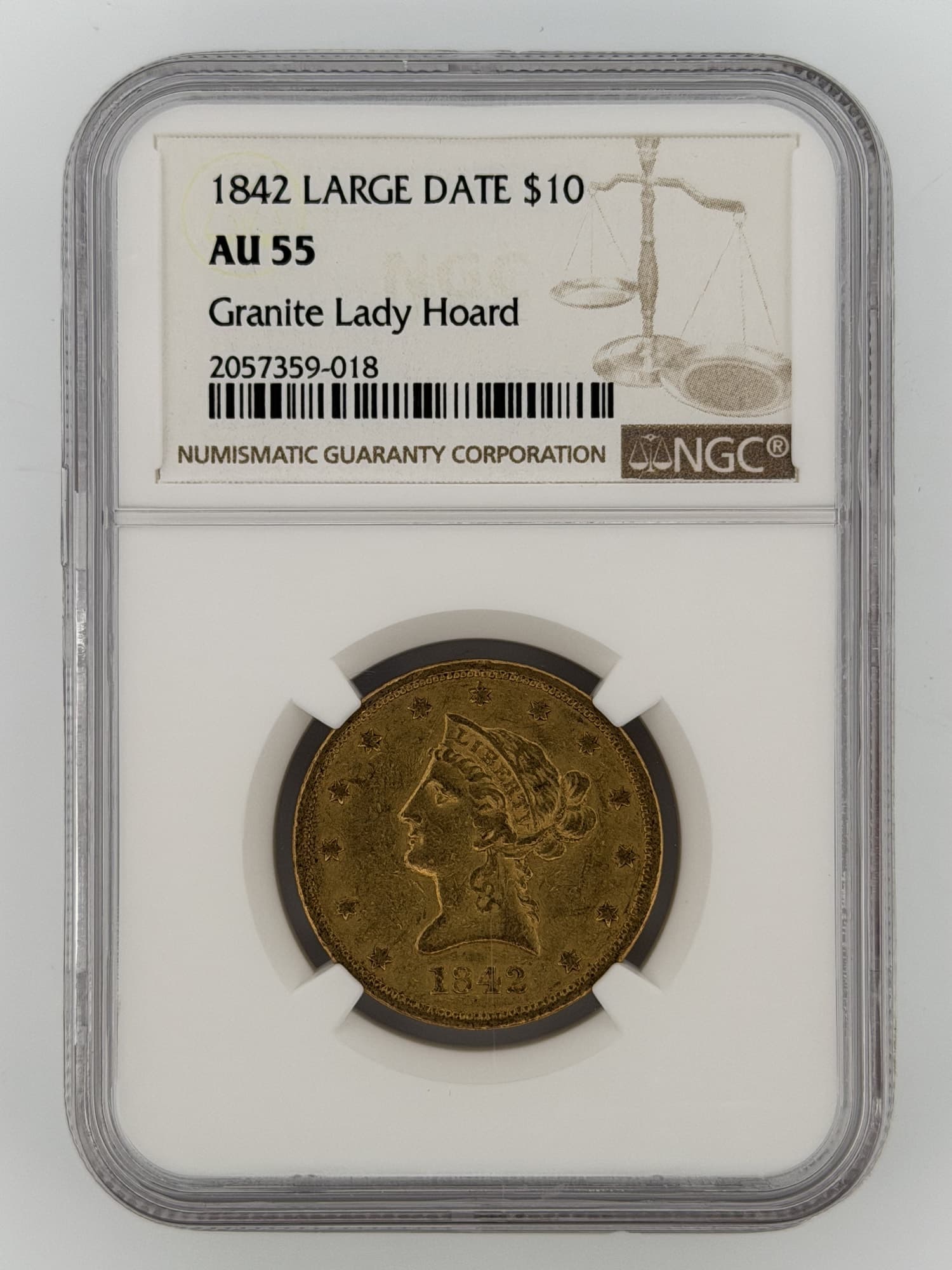 1842 Liberty Head Eagle Large Date $10 Gold NGC AU55 obverse in Granite Lady Hoard slab showing Coronet Liberty portrait and NGC label