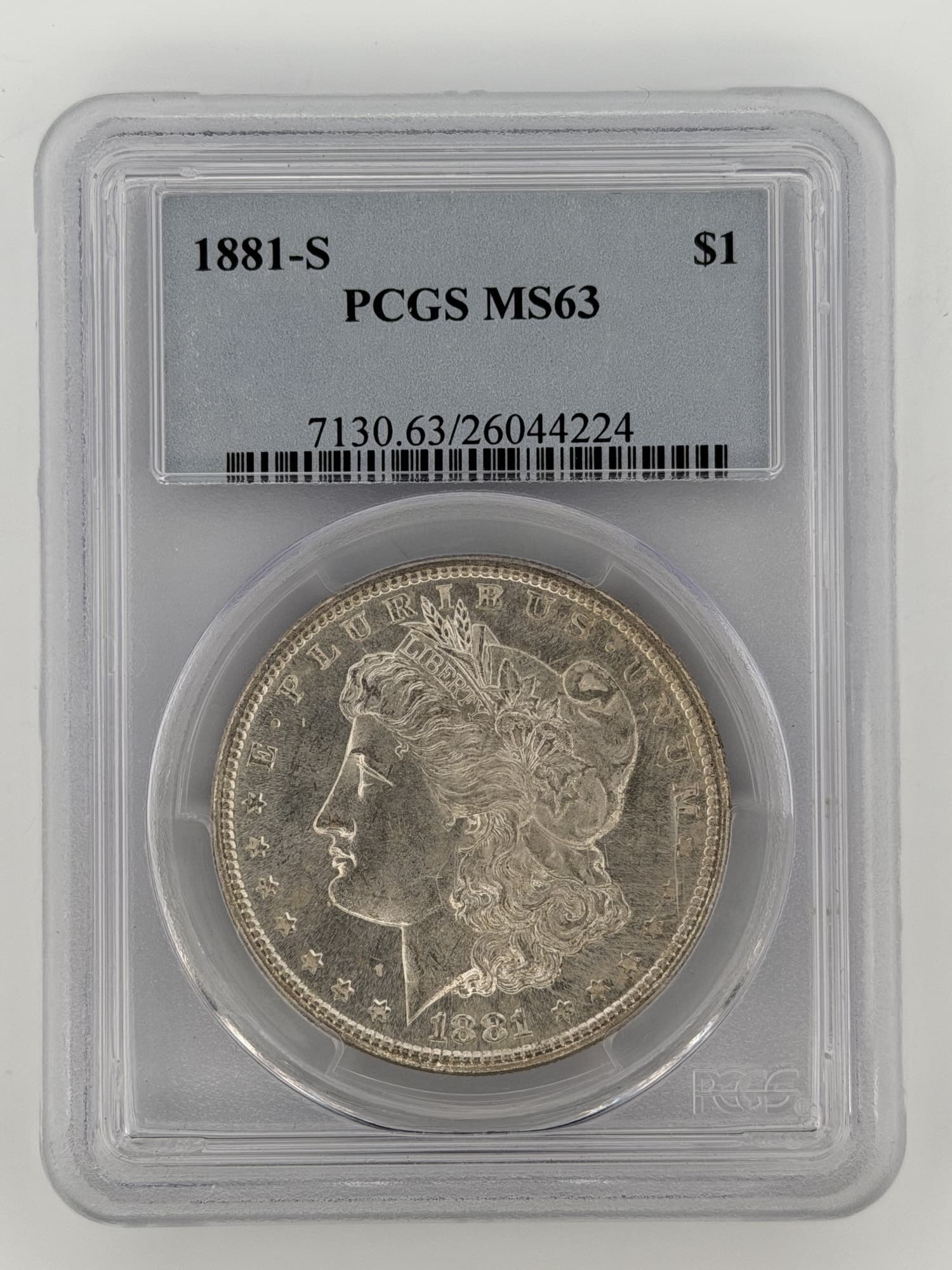 1881-S Morgan Silver Dollar PCGS MS63 obverse showing Liberty portrait and 13 stars in PCGS slab